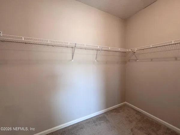 a view of a room with racks on the wall