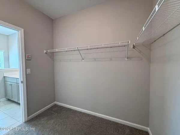 a view of an empty walk in closet