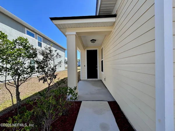 a view of a pathway both side of house