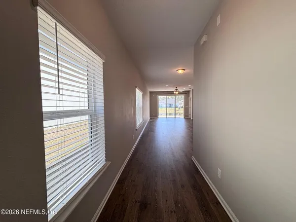 a view of gallery with wooden floor