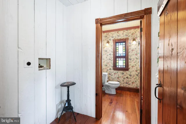 a bathroom with a sink a bathtub and a window