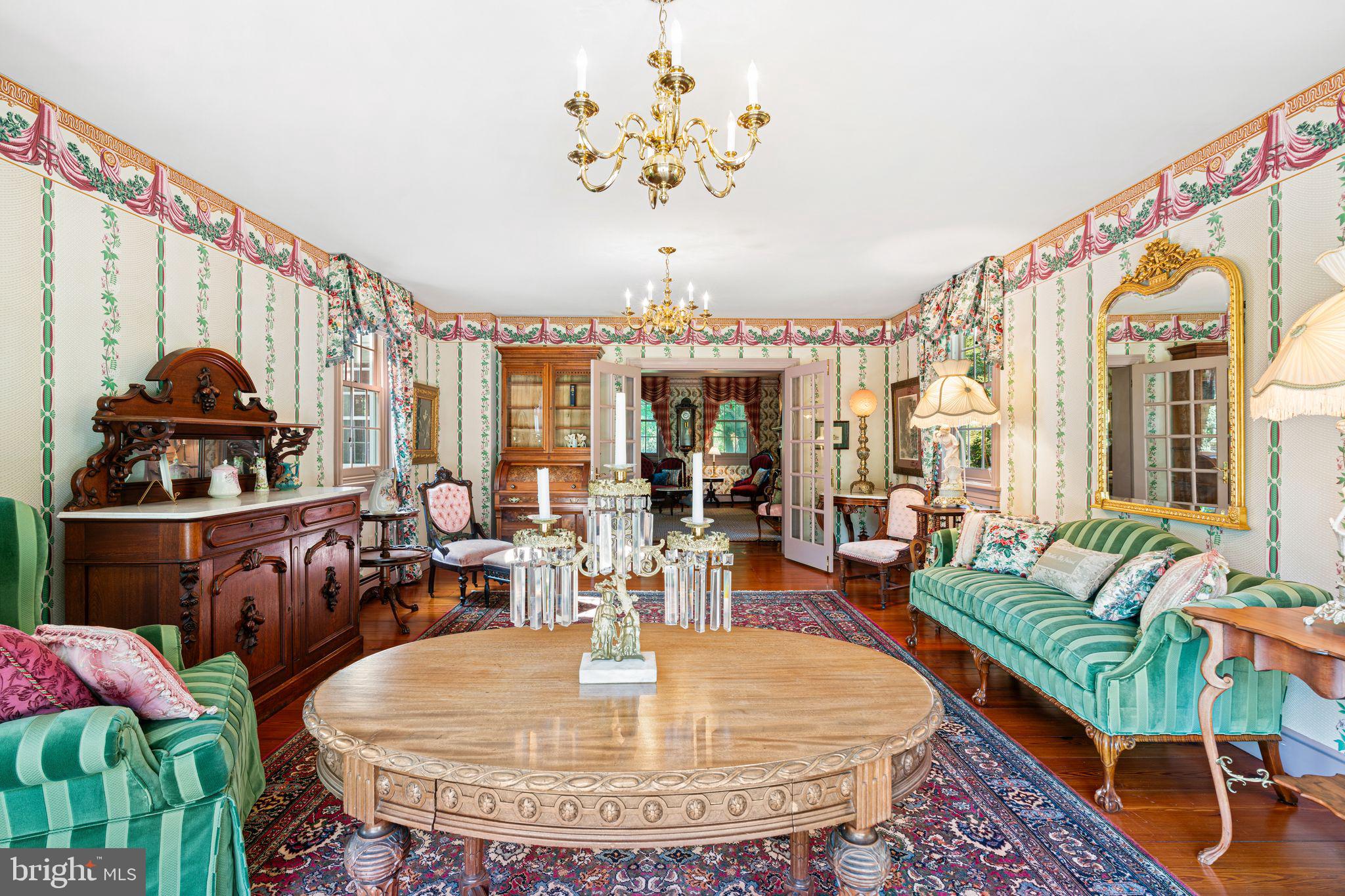 801 Cox Road Moorestown, NJ 08057 - Photo 27 of 110 a view of a dining room with furniture a chandelier and wooden floor