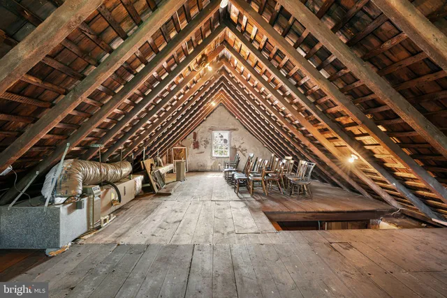 a view of an outdoor sitting area with wooden walls