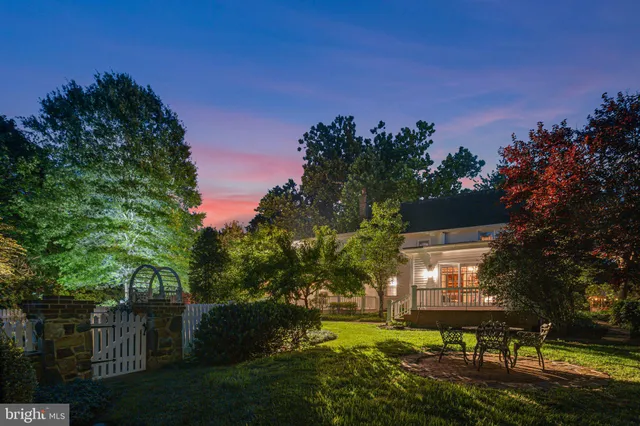 a view of a house with backyard and porch