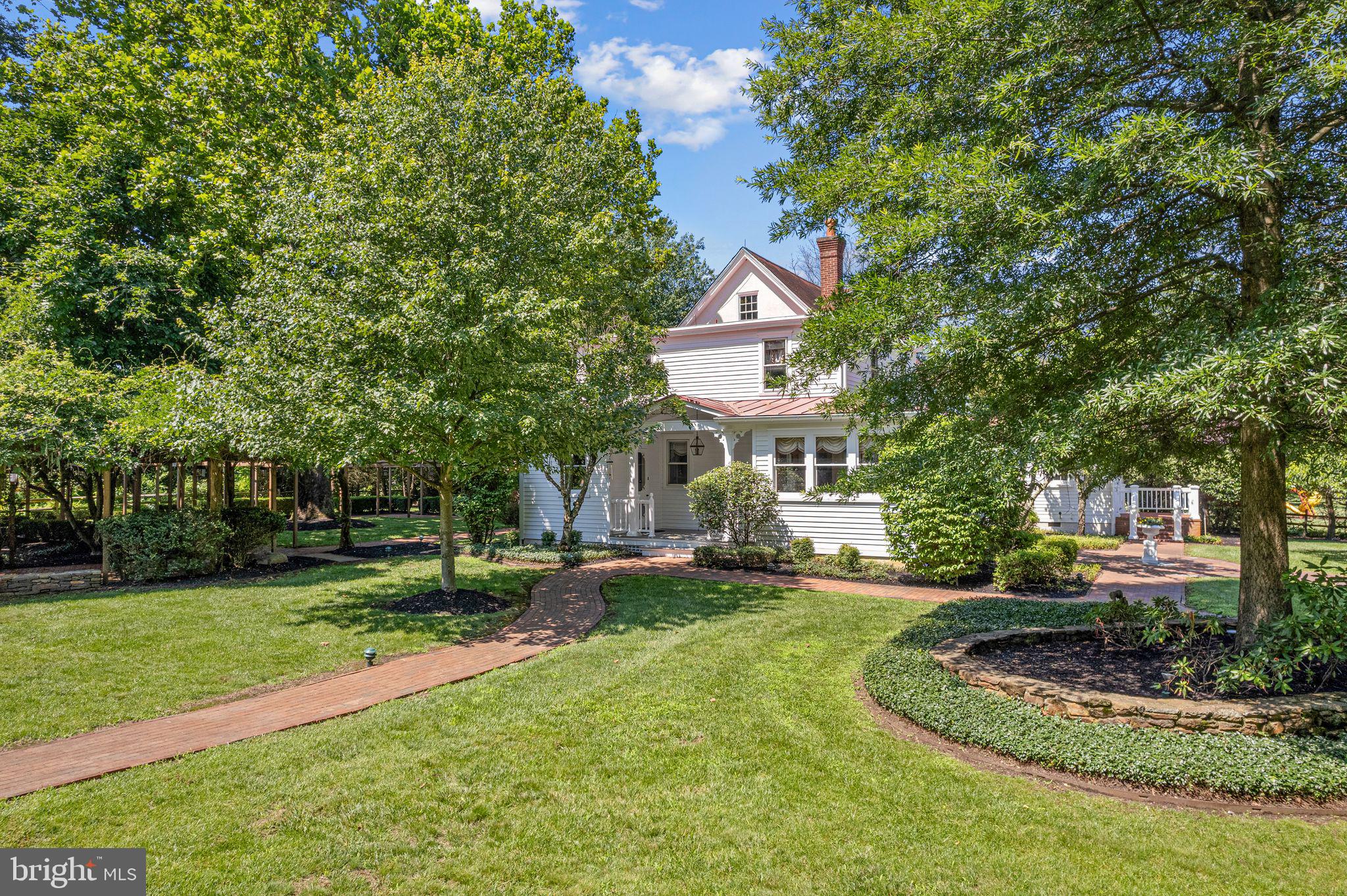 801 Cox Road Moorestown, NJ 08057 - Photo 56 of 110 a front view of a house with a yard and trees