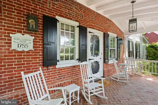 a dining room with furniture window and wooden floor