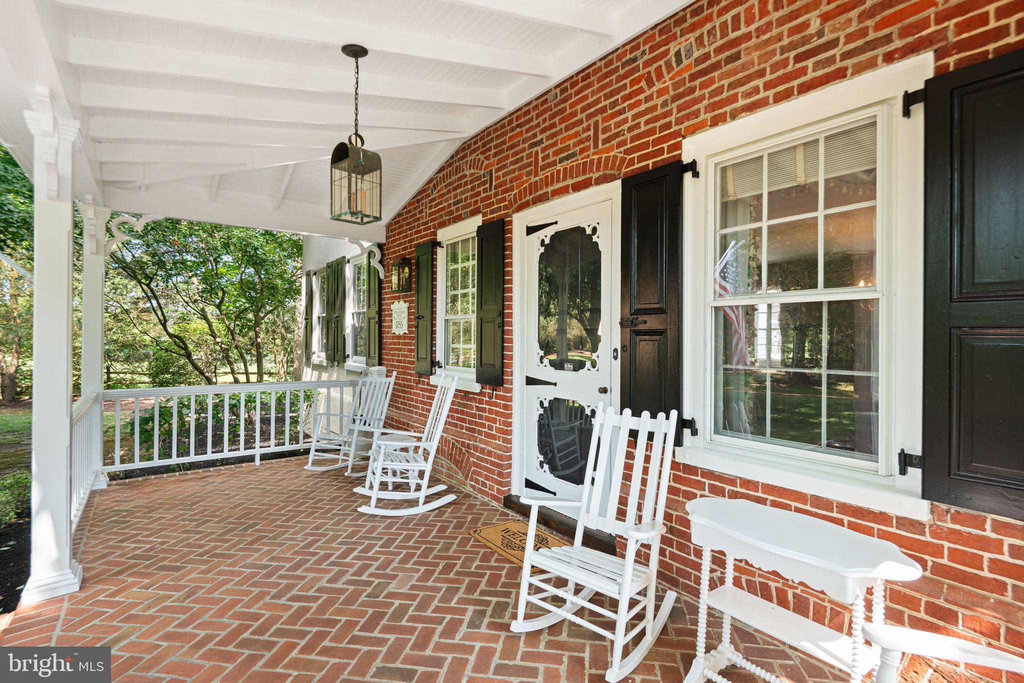 801 Cox Road Moorestown, NJ 08057 - Photo 8 of 110 a view of a patio with a table chairs and wooden fence