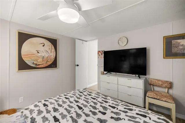 a bedroom with a bed and television