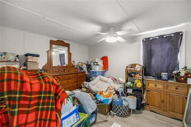 a bed room with furniture and a window