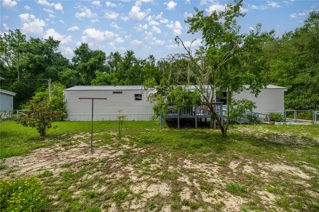 a backyard of a house with lots of green space