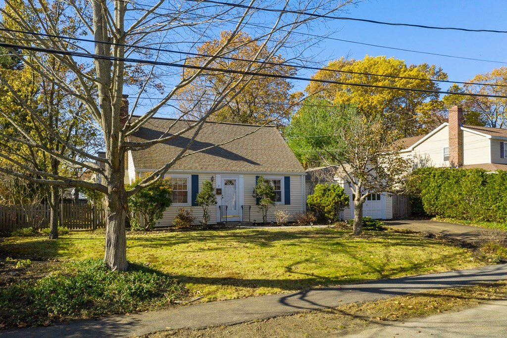 a house view with swimming pool in front of it