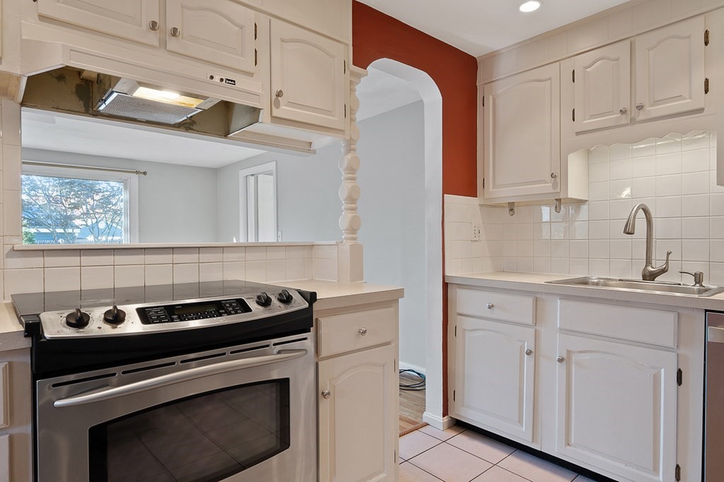2 Craft Road Natick, MA 01760 - Photo 11 of 42 a kitchen with white cabinets and appliances