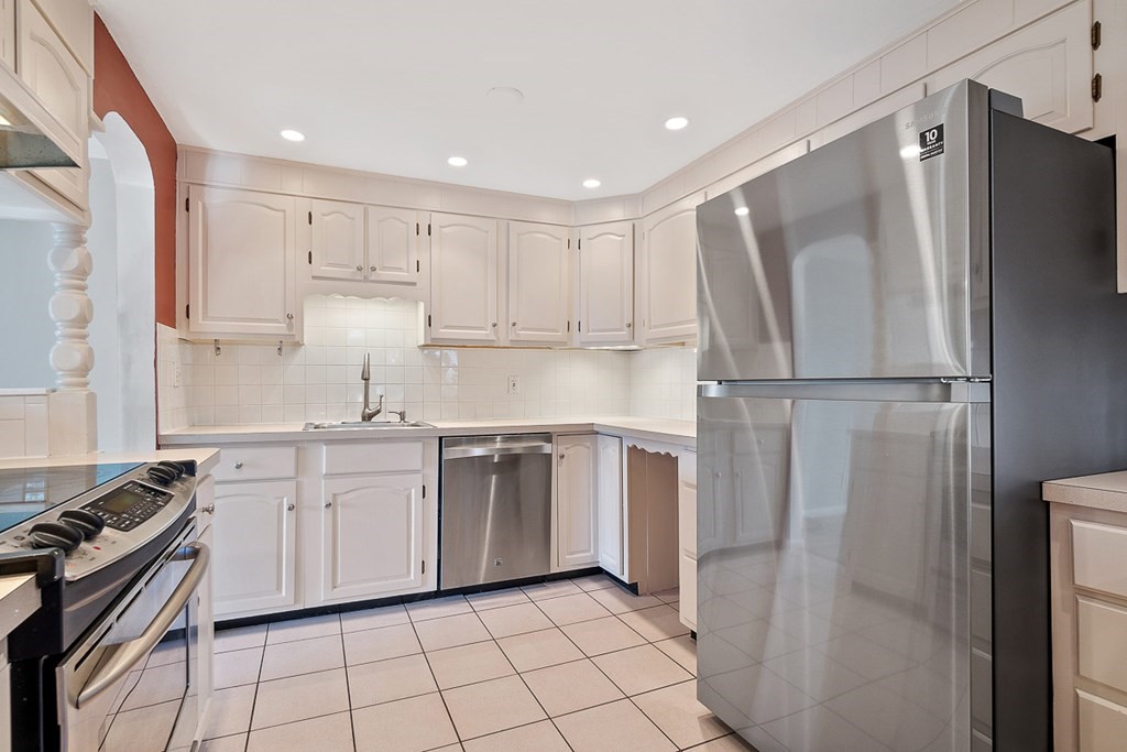 2 Craft Road Natick, MA 01760 - Photo 12 of 42 a kitchen with white cabinets and appliances