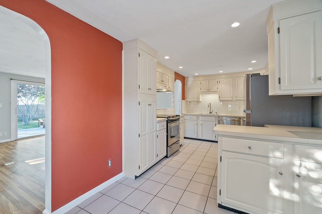 2 Craft Road Natick, MA 01760 - Photo 13 of 42 a kitchen with white cabinets and appliances
