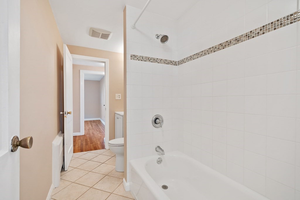 2 Craft Road Natick, MA 01760 - Photo 22 of 42 a bathroom with a bathtub and a shower