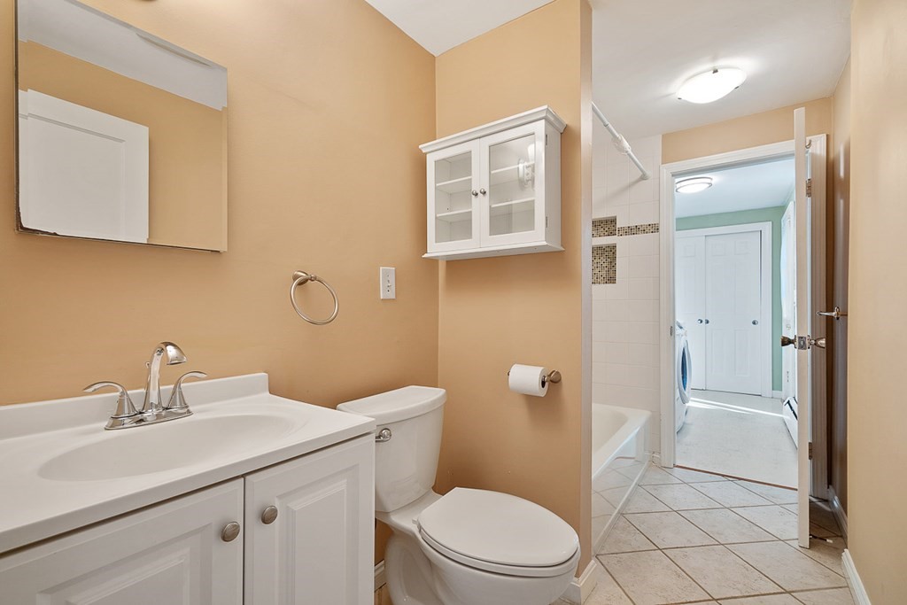 2 Craft Road Natick, MA 01760 - Photo 23 of 42 a bathroom with a sink a toilet and shower