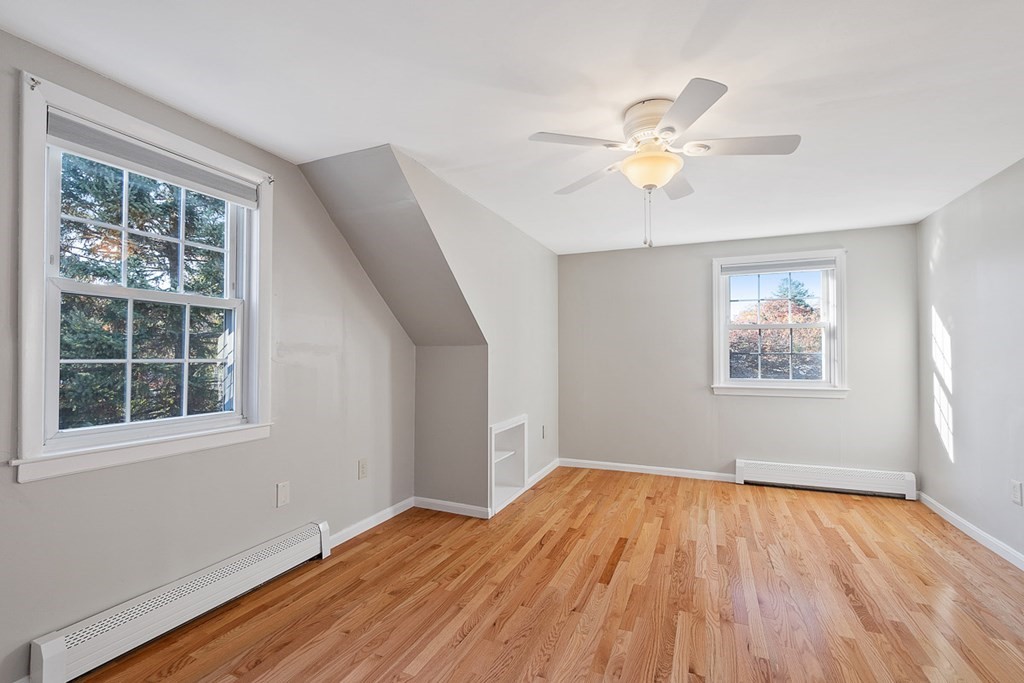 2 Craft Road Natick, MA 01760 - Photo 25 of 42 a view of an empty room with window and wooden floor