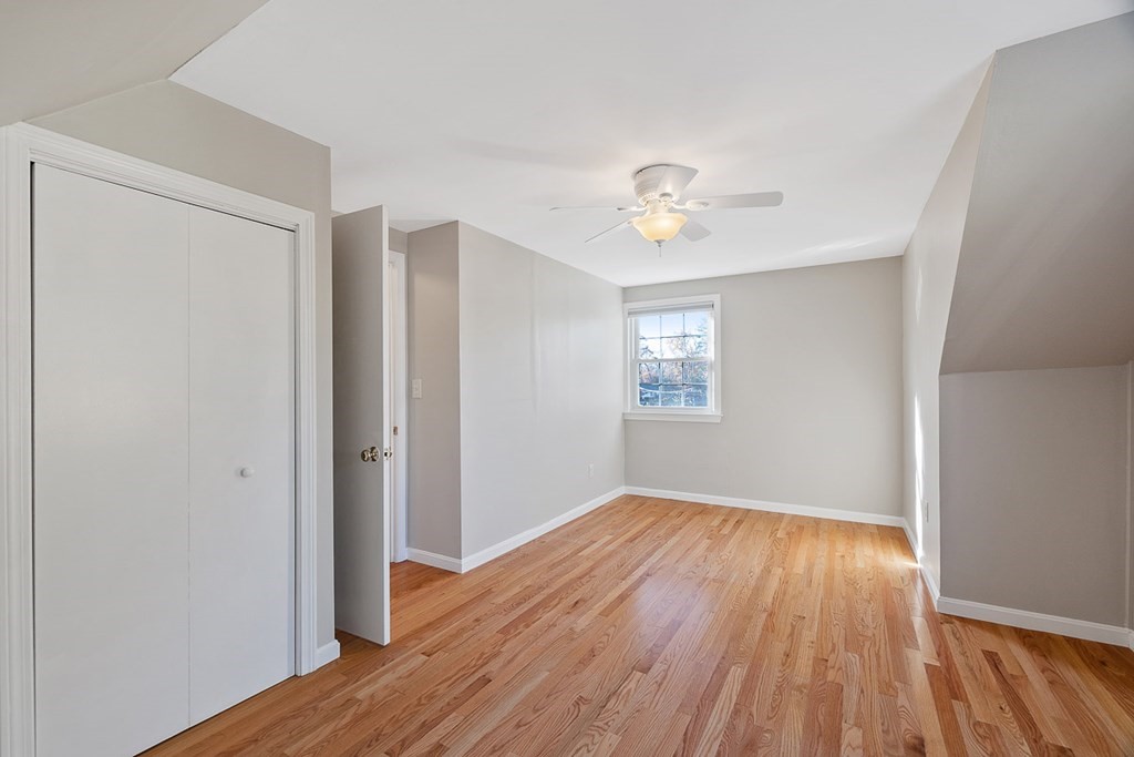 2 Craft Road Natick, MA 01760 - Photo 27 of 42 an empty room with wooden floor and windows