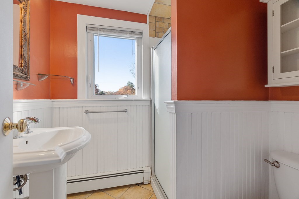 2 Craft Road Natick, MA 01760 - Photo 29 of 42 a bathroom with a sink and a mirror