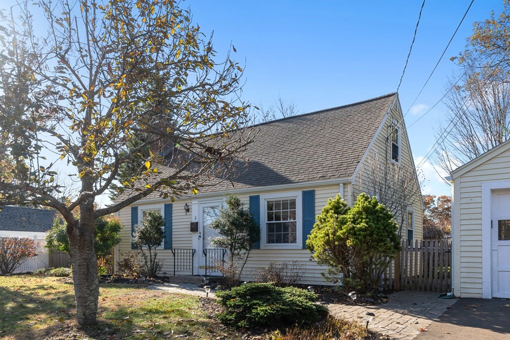 2 Craft Road Natick, MA 01760 - Photo 5 of 42 a front view of a house with garden