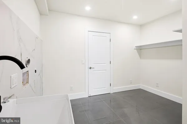 a view of a sink and cabinets