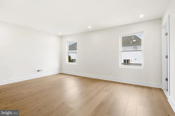 a bedroom with a bed and a night stand