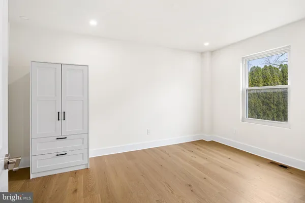 a bedroom with a bed and closet