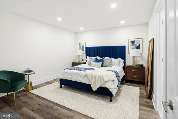 a bedroom with a bed and a night stand