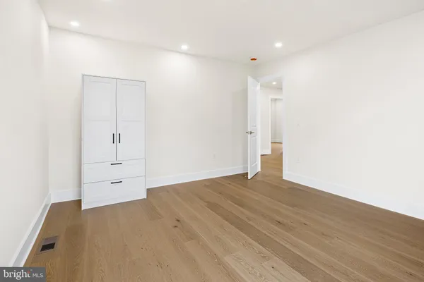 a view of wooden floor in an empty room