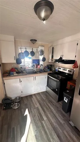 a bathroom with a sink mirror and toilet
