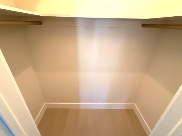 a bathroom with a toilet sink mirror and mirror