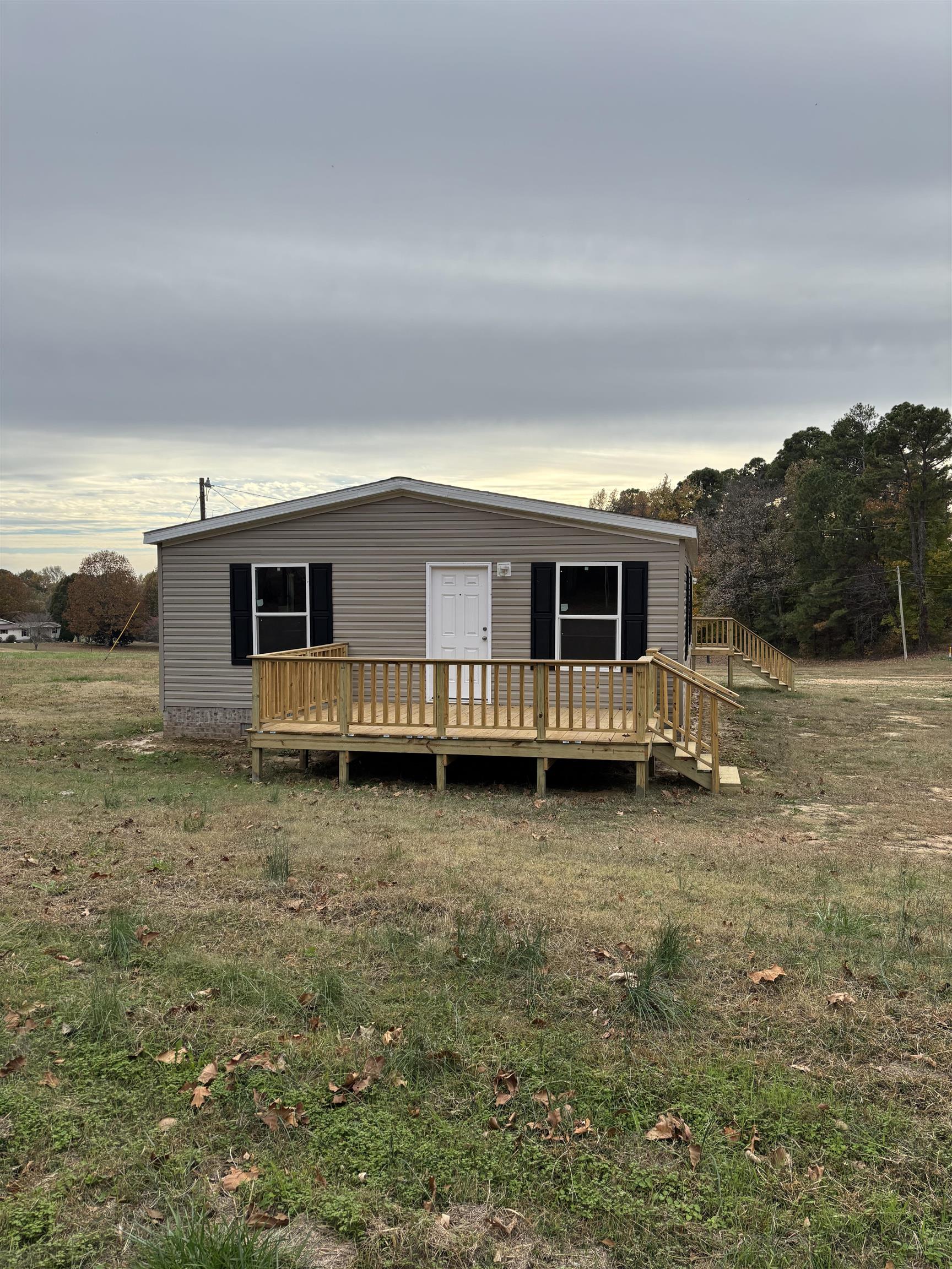 1131 Hobe Webb Road Ripley, TN 38063 - Photo 13 of 27 a view of a house with a backyard