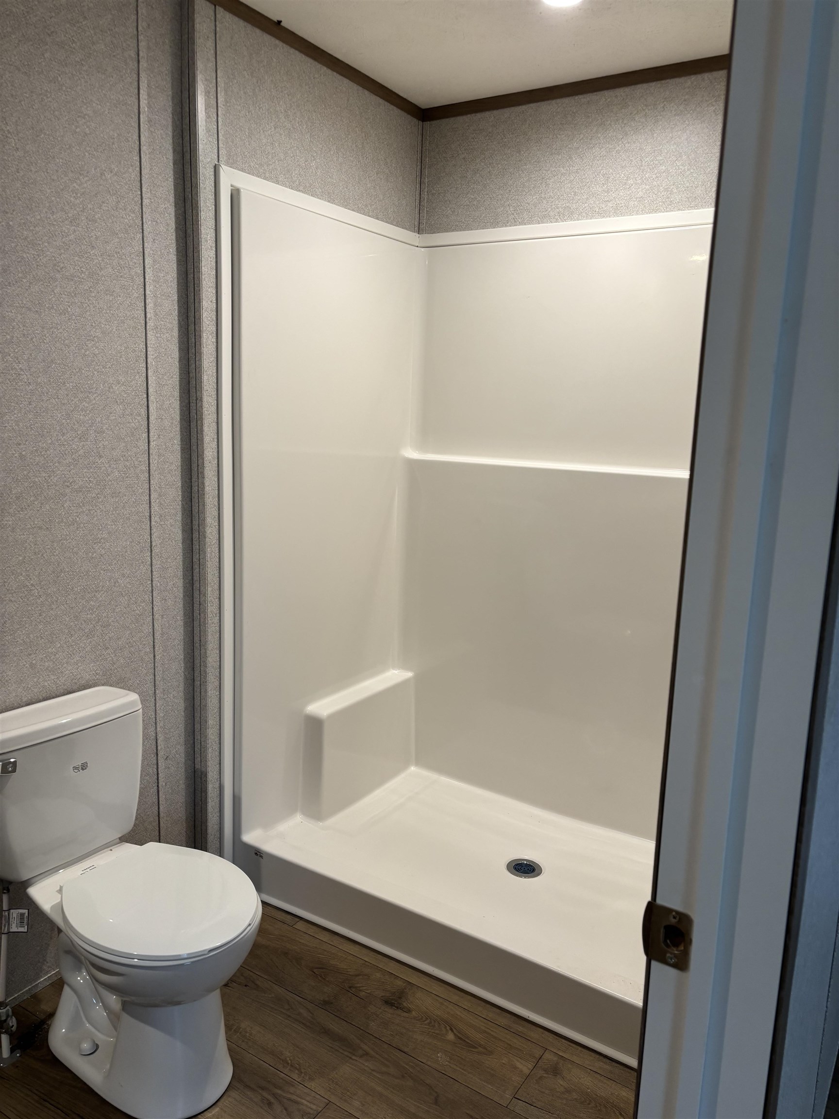 1131 Hobe Webb Road Ripley, TN 38063 - Photo 14 of 27 a bathroom with a shower and a toilet