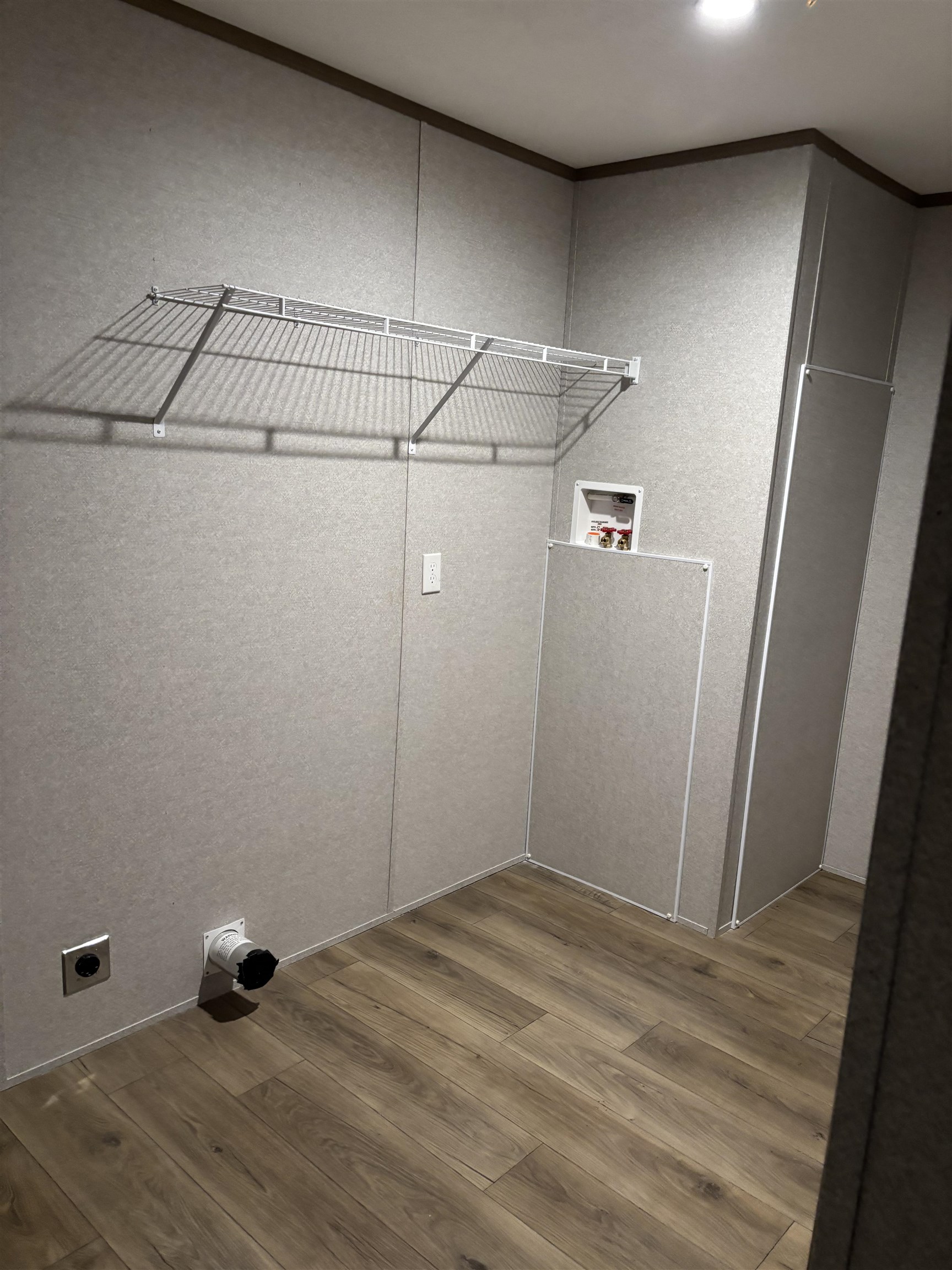 1131 Hobe Webb Road Ripley, TN 38063 - Photo 15 of 27 a view of a room with wooden floor