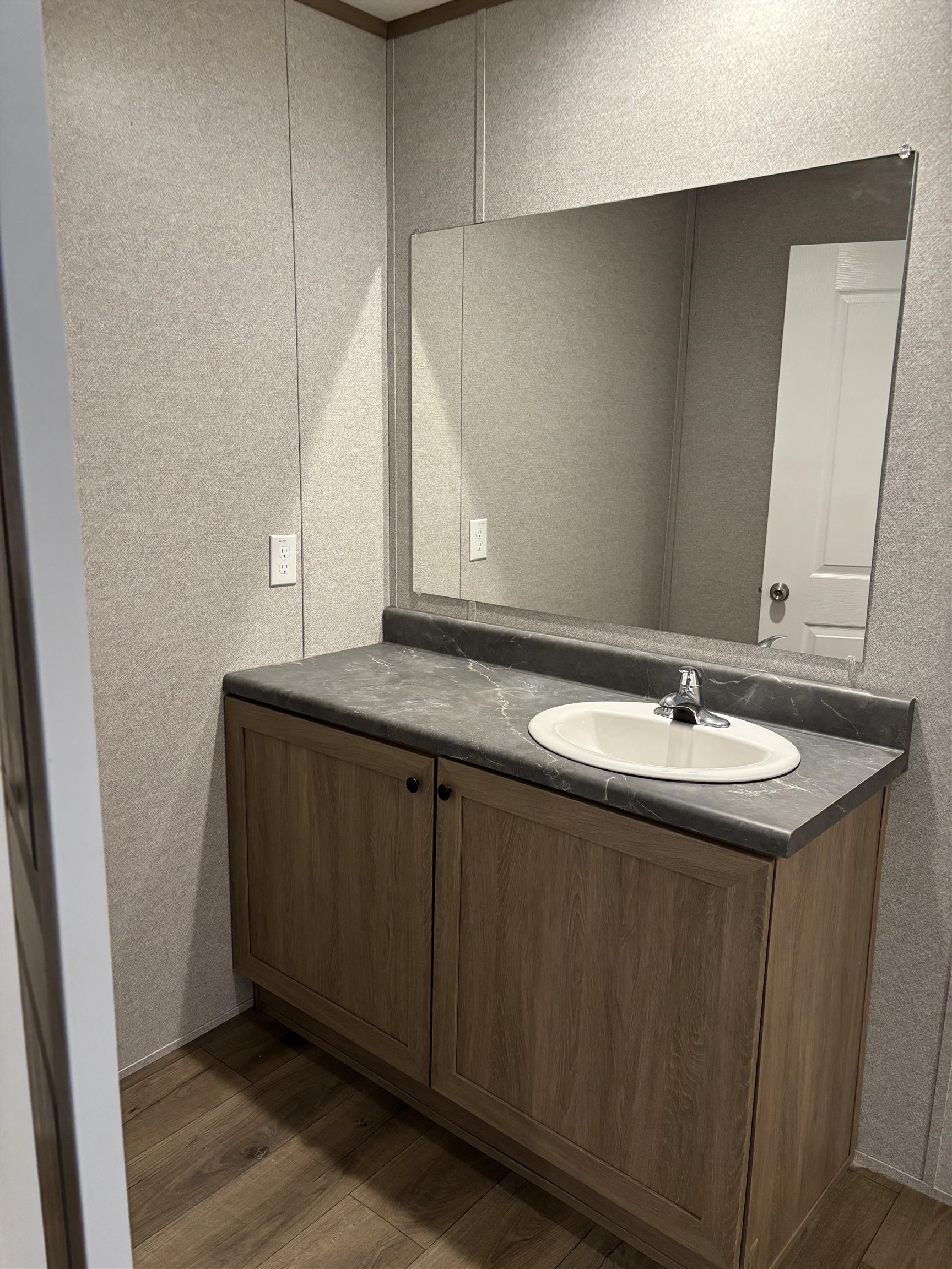 1131 Hobe Webb Road Ripley, TN 38063 - Photo 16 of 27 a bathroom with a sink and a mirror