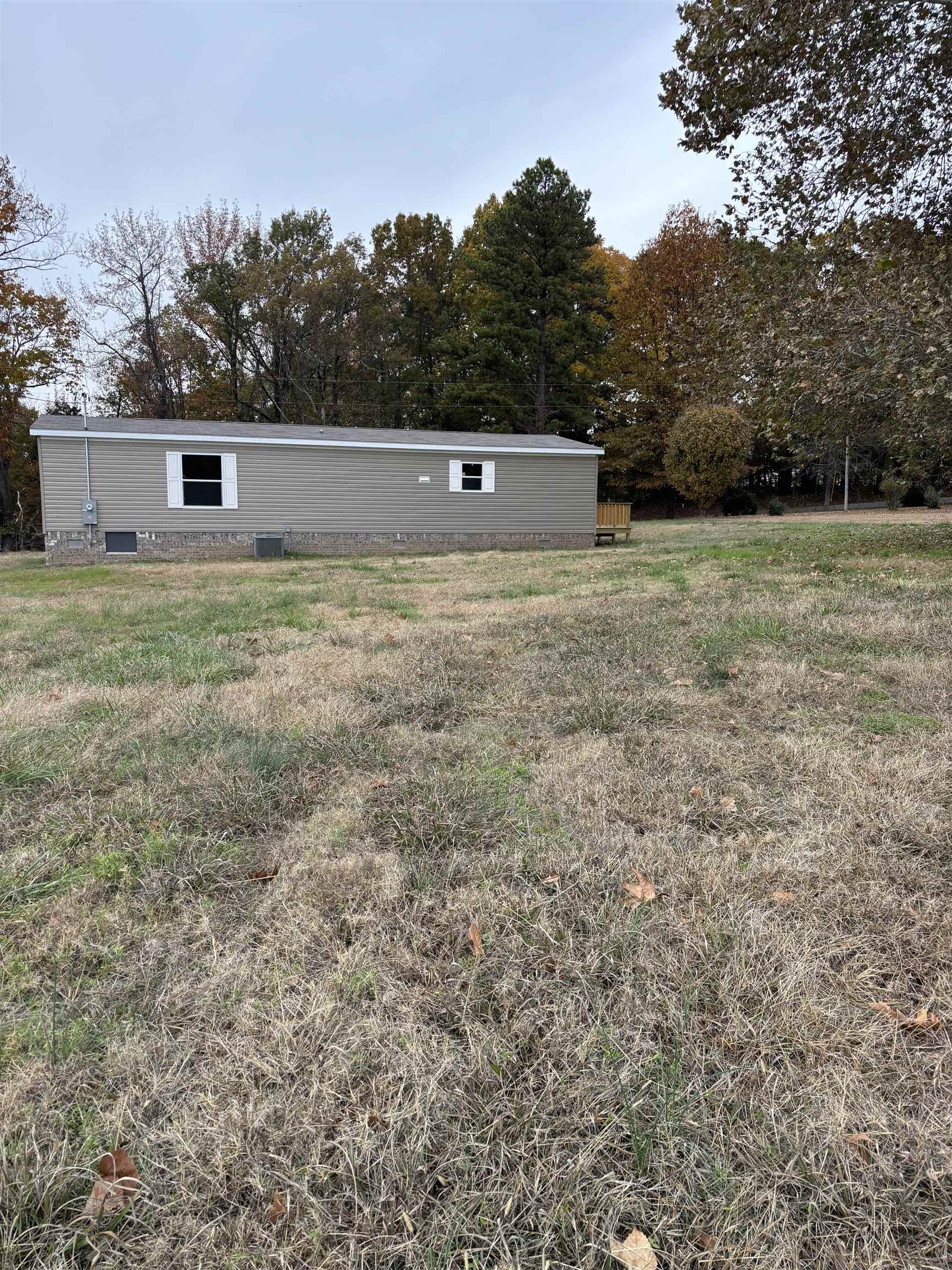 1131 Hobe Webb Road Ripley, TN 38063 - Photo 27 of 27 a view of a big yard with wooden fence