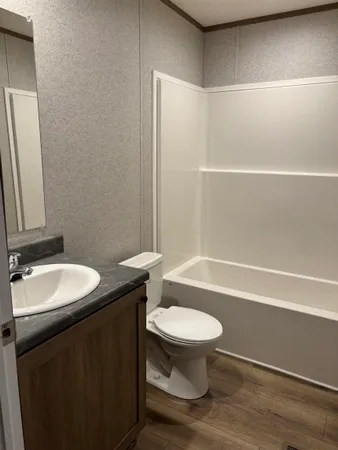 a large kitchen with stainless steel appliances granite countertop a stove a sink dishwasher and a refrigerator