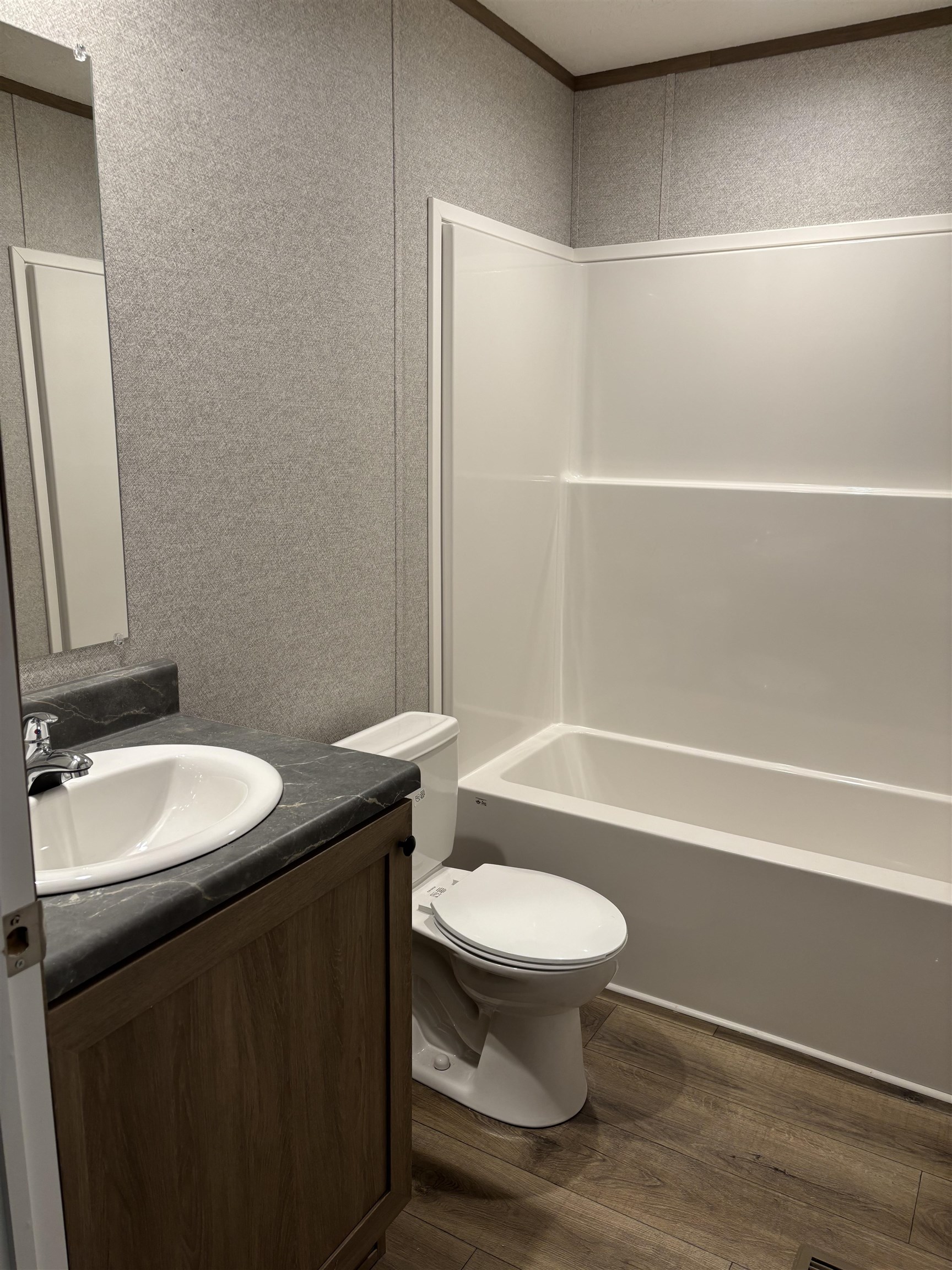 1131 Hobe Webb Road Ripley, TN 38063 - Photo 8 of 27 a bathroom with a sink a toilet and a bathtub