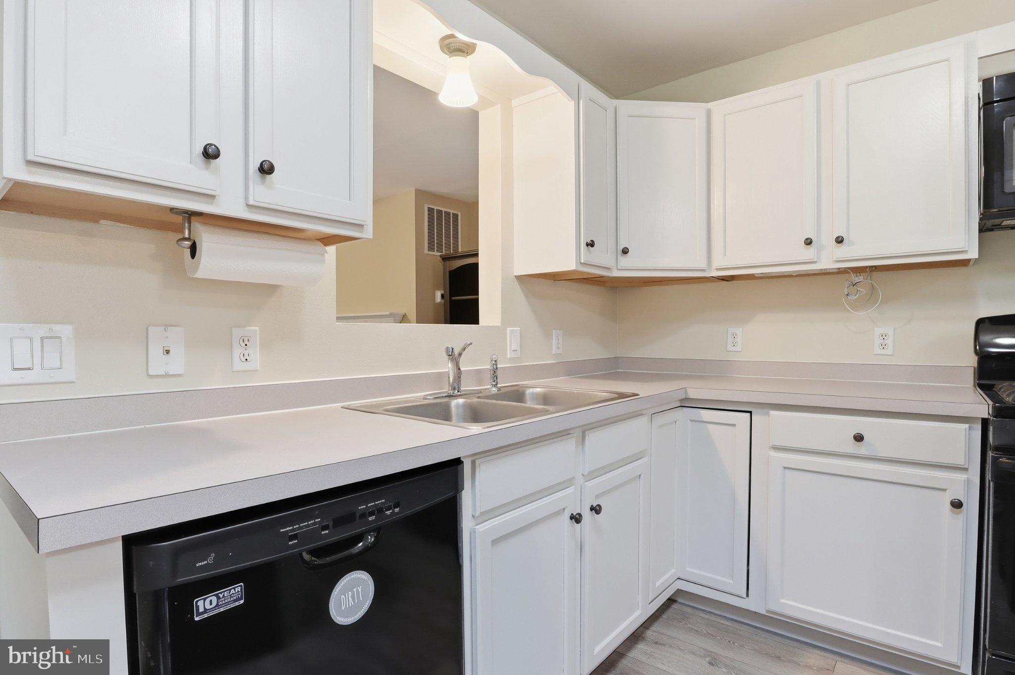 491 Garvine Mill Road Fawn Grove, PA 17321 - Photo 9 of 47 a kitchen with white cabinets and a sink