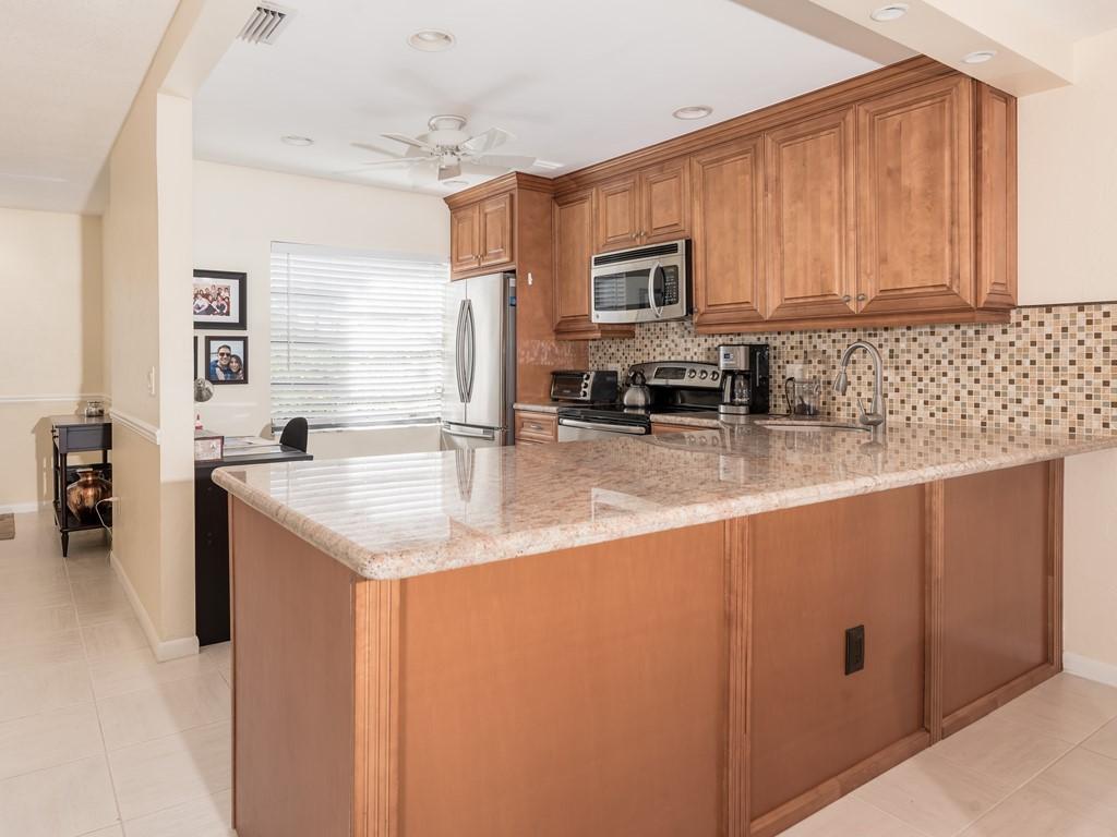 8460 Casa Del Lago, Unit G Boca Raton, FL 33433 - Photo 4 of 14 Kitchen Island