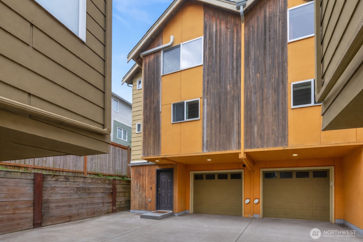 a front view of a house with garage