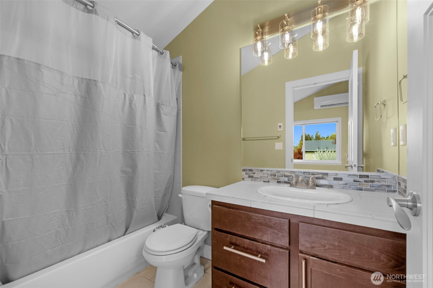 2118 West Ruffner Street Seattle, WA 98199 - Photo 16 of 37 a bathroom with a sink a toilet and a mirror