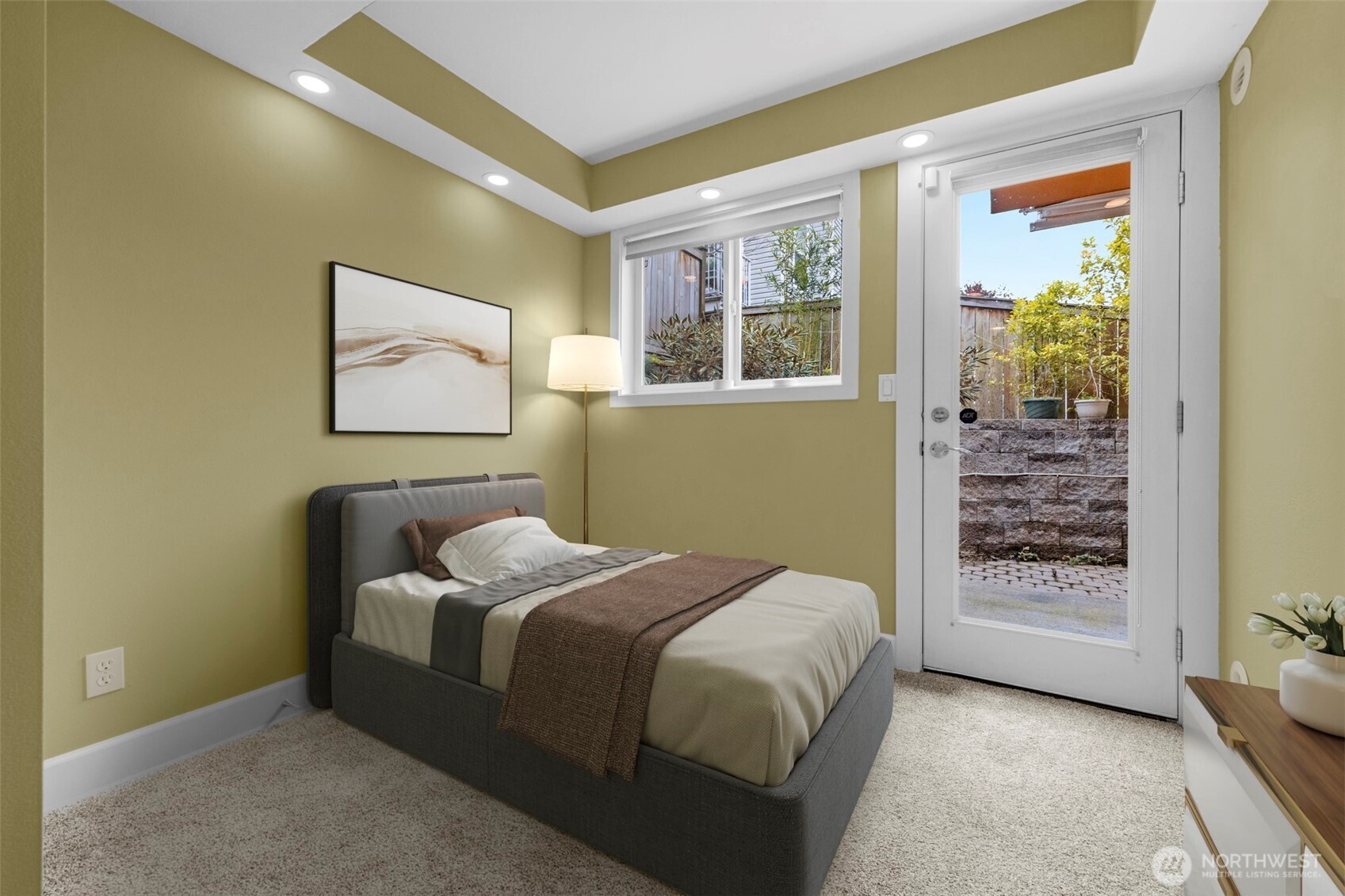 2118 West Ruffner Street Seattle, WA 98199 - Photo 22 of 37 a bedroom with a bed and a painting on the wall