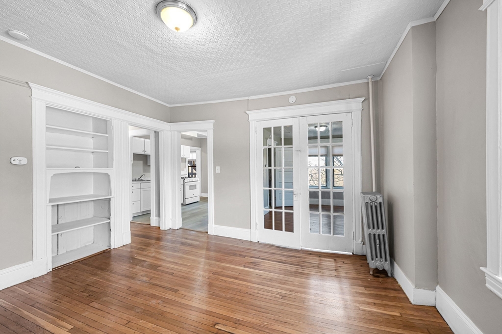 92 Woodside Terrace, Unit 3R Springfield, MA 01108 - Photo 12 of 42 a view of wooden floor and windows in a room