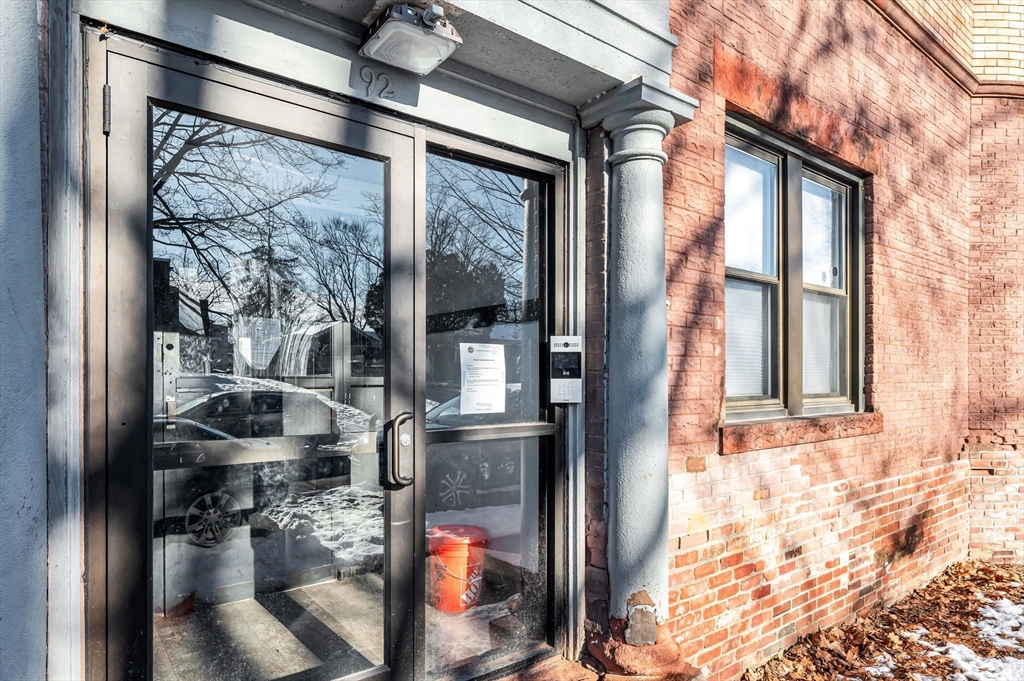 92 Woodside Terrace, Unit 3R Springfield, MA 01108 - Photo 34 of 42 a front view of a house with a glass windows and door