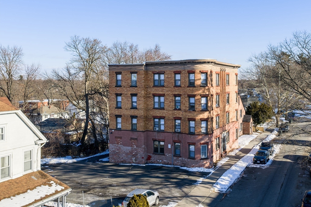 92 Woodside Terrace, Unit 3R Springfield, MA 01108 - Photo 38 of 42 a front view of a house with a yard