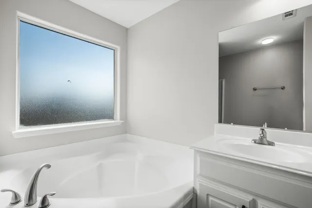 a bathroom with a sink and a bathtub
