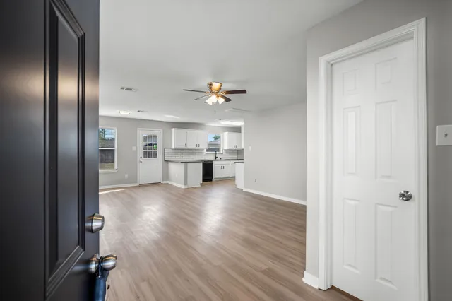 a view of a kitchen with a sink and cabinet area