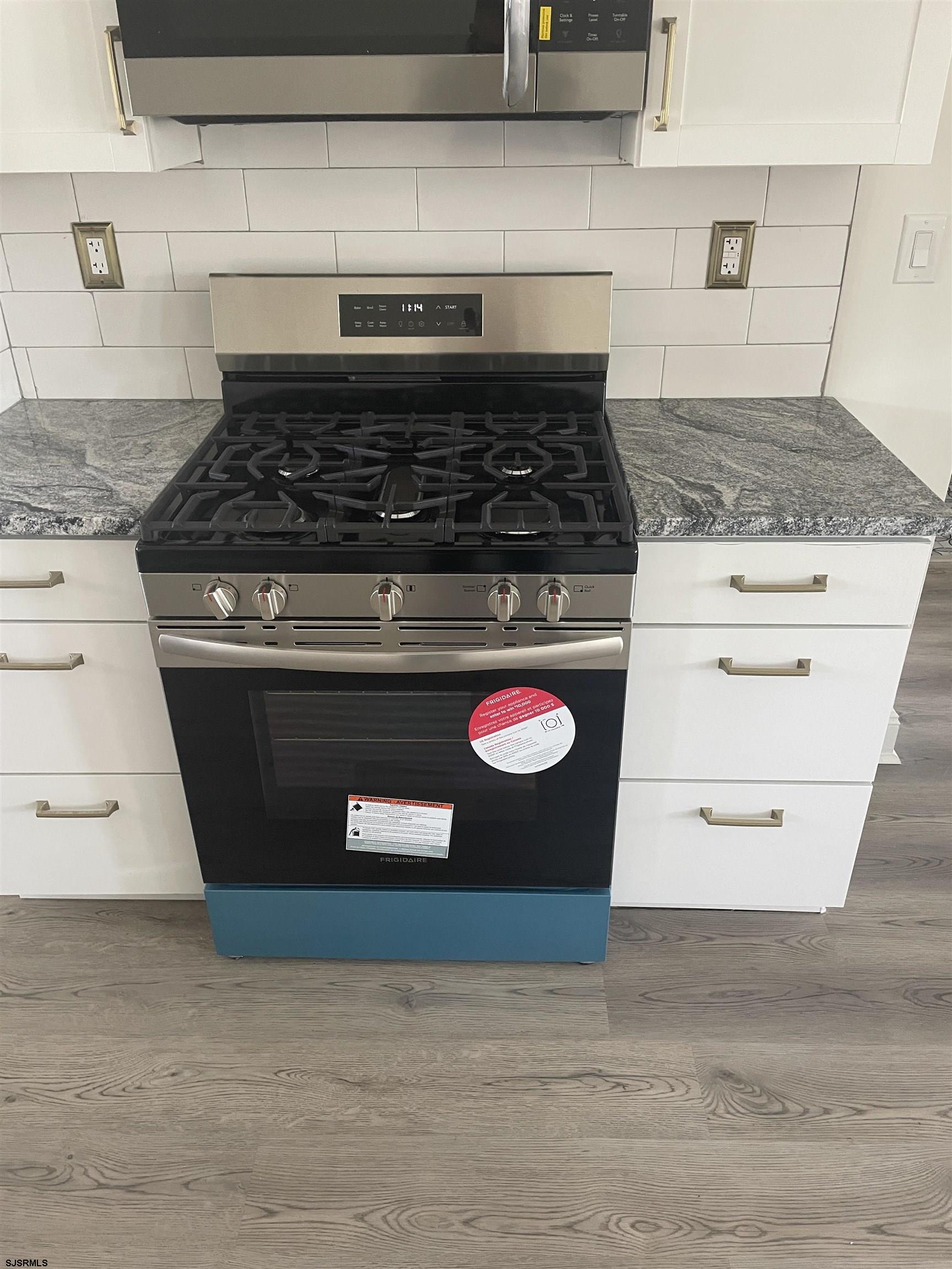 509 Buffalo Avenue Egg Harbor City, NJ 08215 - Photo 11 of 14 a stove top oven sitting inside of a kitchen