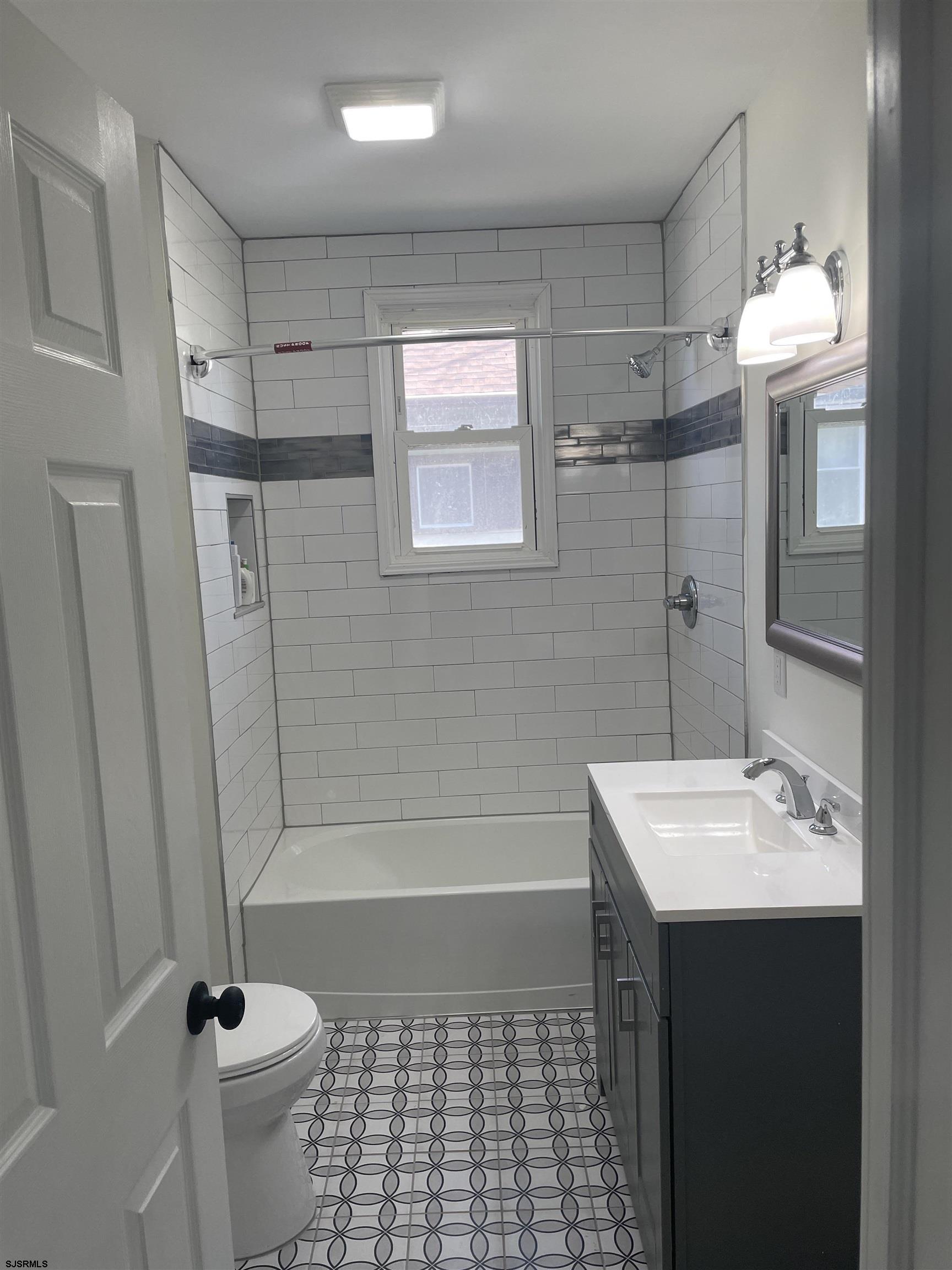 509 Buffalo Avenue Egg Harbor City, NJ 08215 - Photo 4 of 14 a bathroom with a sink a toilet and shower